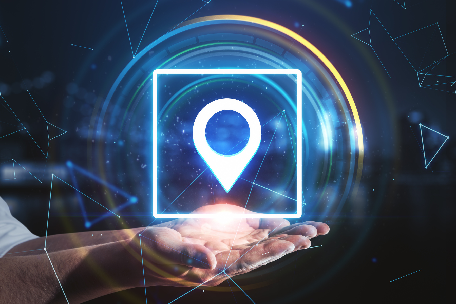 Hand holding glowing digital geolocation gps interface.